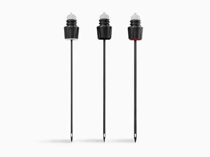 Three garden markers with black stakes and tops, one featuring a red detail, designed for labeling plants.