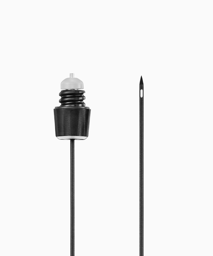 Black Coravin needle with a clear plunger and a needle on the side, used for precise liquid measurements or injections.