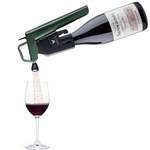 A Coravin wine pouring device dispensing red wine into a glass, showcasing the bottle label "Château La Sauvagonne."