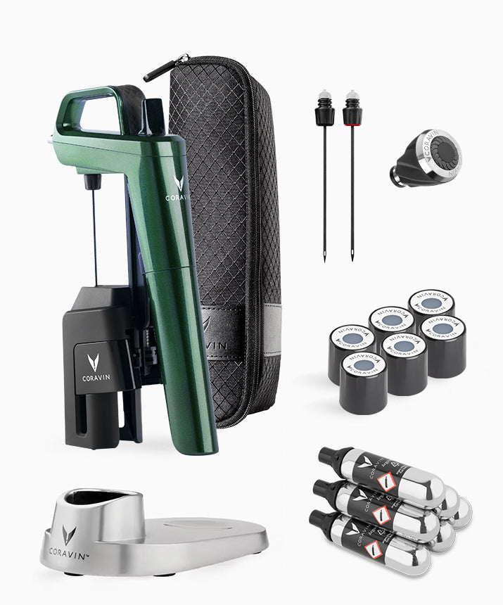 Coravin wine preservation system with green opener, black carrying case, accessories, and several gas canisters.